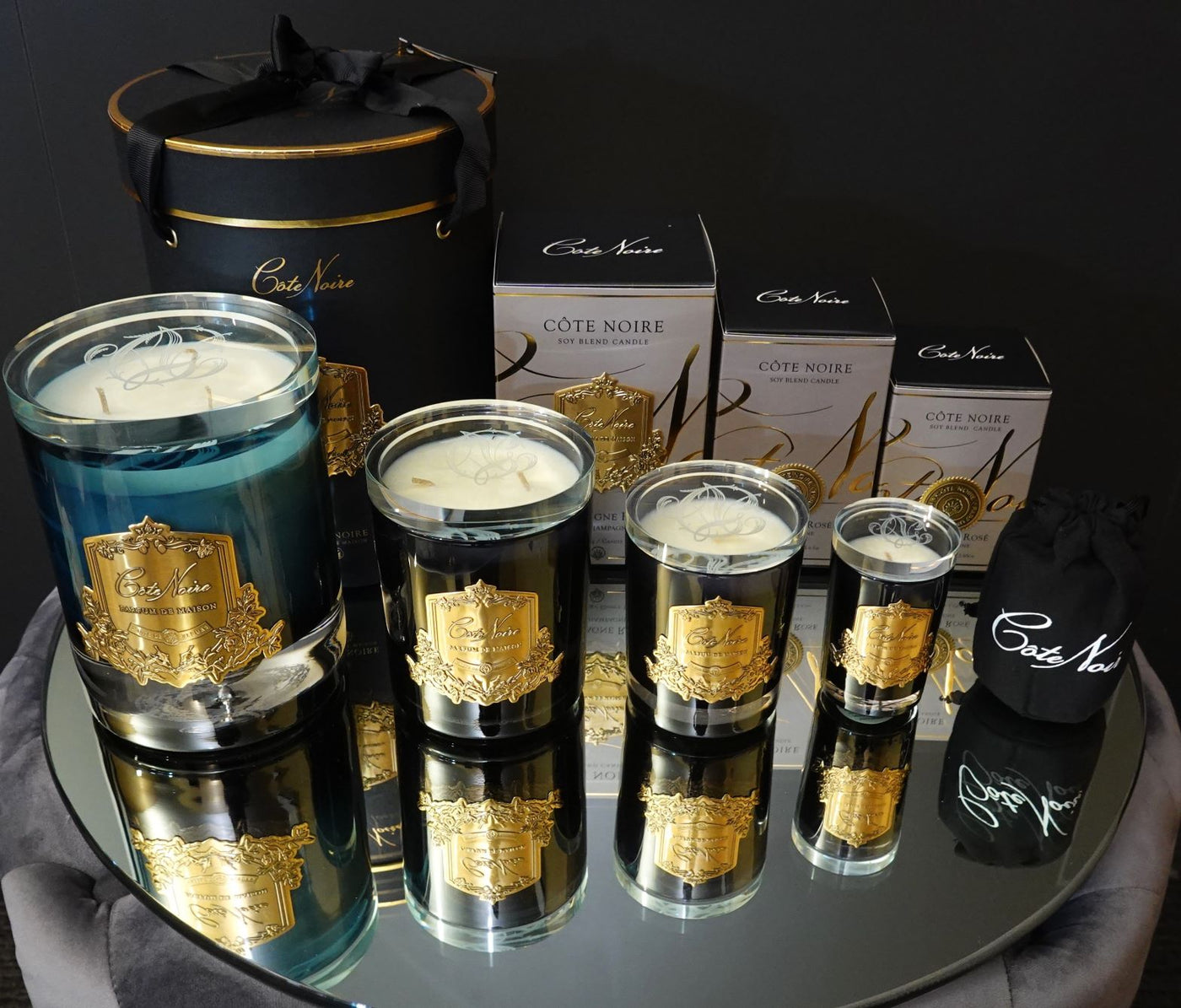 Cote Noire Candles - Dark Vessel with Gold Badge - Pink Champagne
