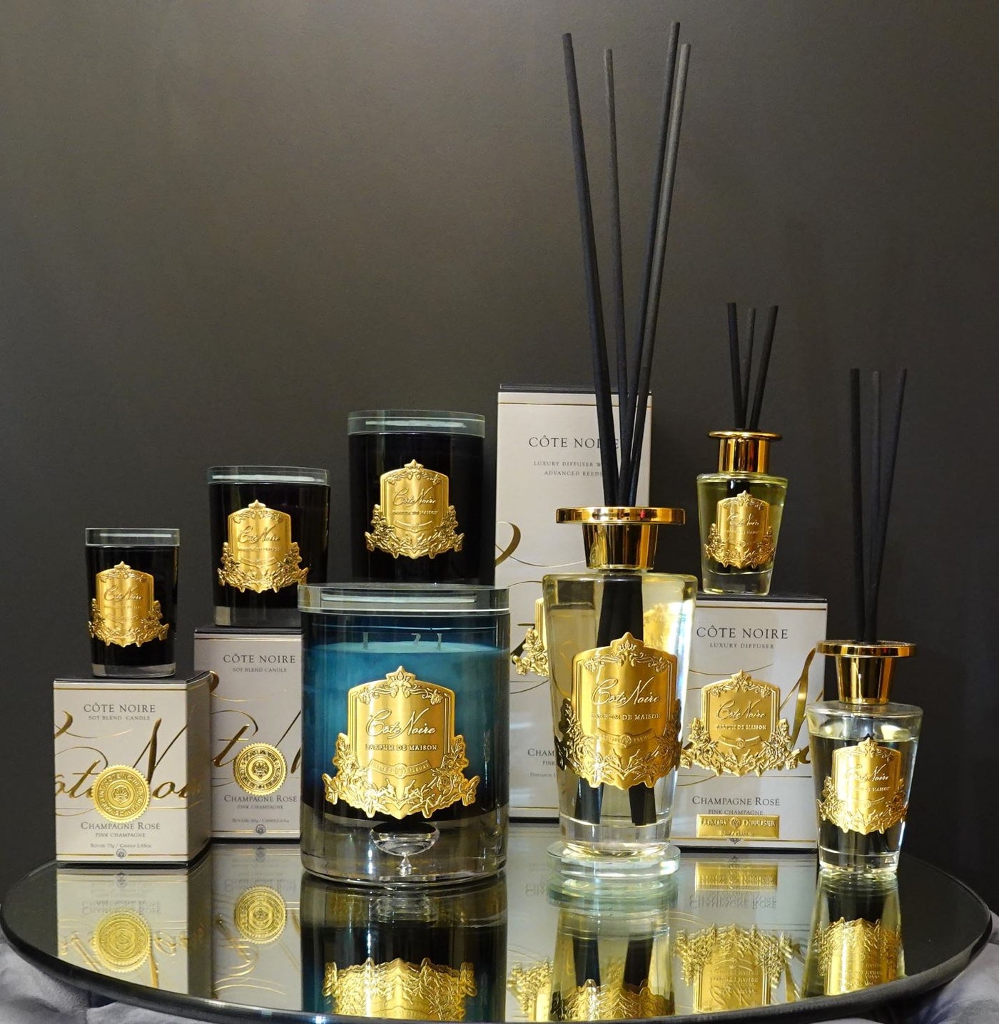 Cote Noire Candles - Dark Vessel with Gold Badge - Pink Champagne